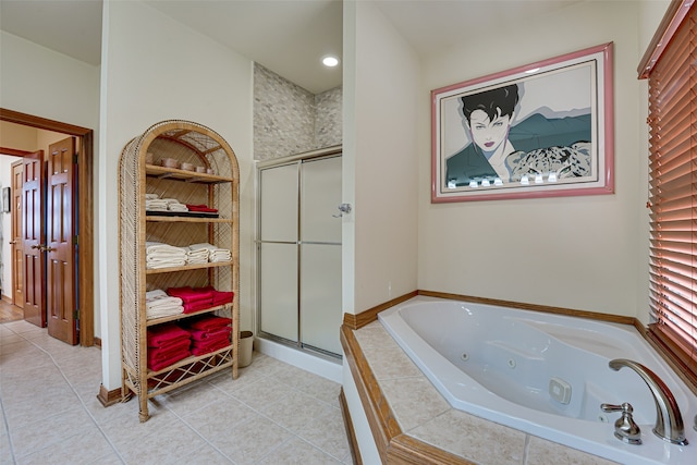 bathroom with tile patterned floors and plus walk in shower