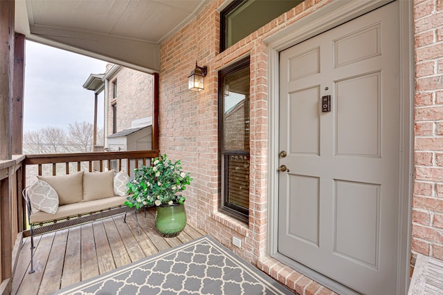 view of exterior entry with a porch