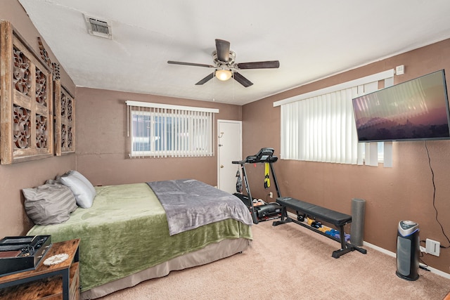 carpeted bedroom with ceiling fan