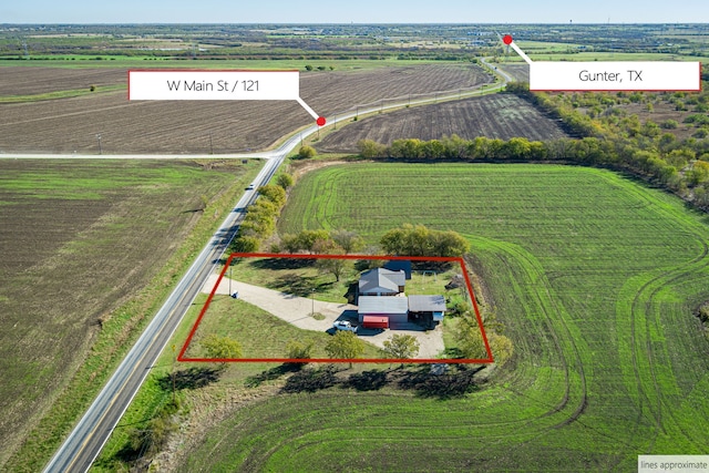 birds eye view of property featuring a rural view