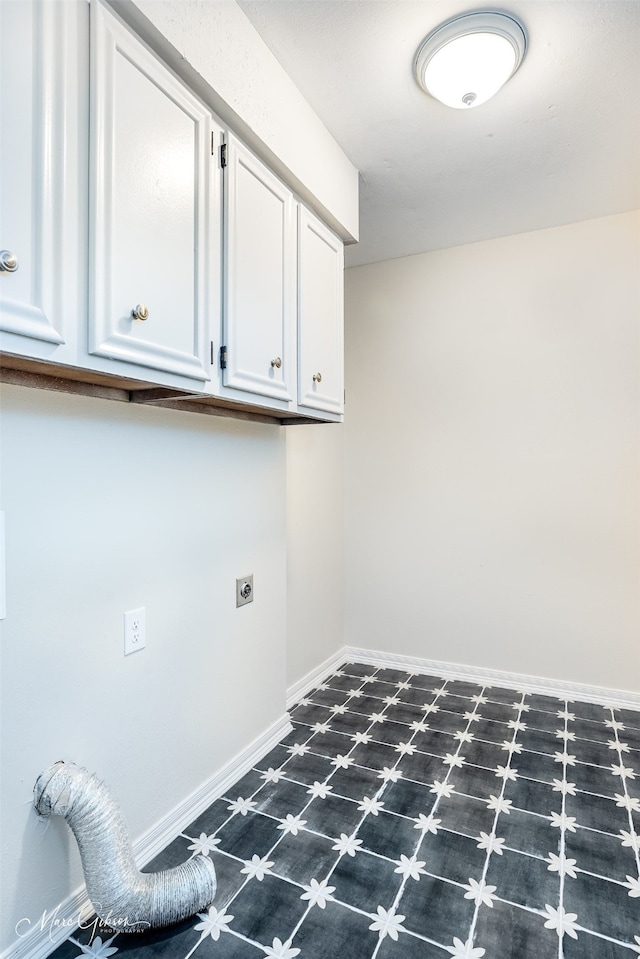 laundry area featuring cabinets and hookup for an electric dryer