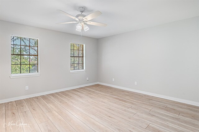 spare room with plenty of natural light and light wood-type flooring