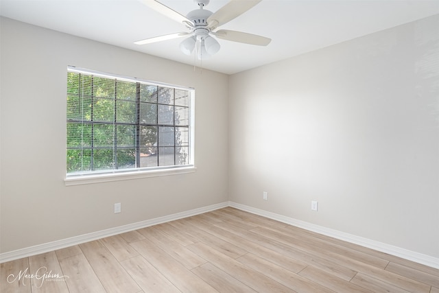 unfurnished room with ceiling fan and light wood-type flooring