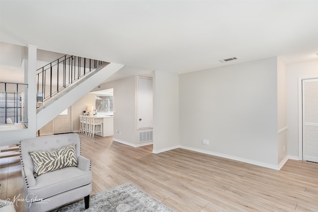 living room with light hardwood / wood-style floors