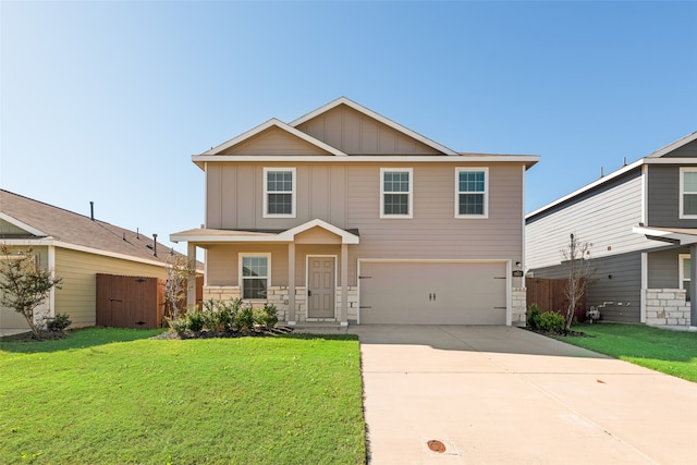 view of front of property with a garage and a front yard