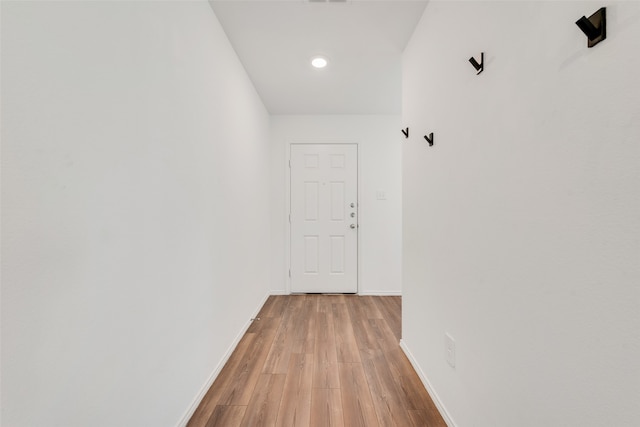 hall with light wood-type flooring