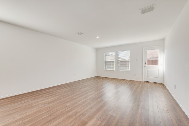 unfurnished room featuring light hardwood / wood-style floors