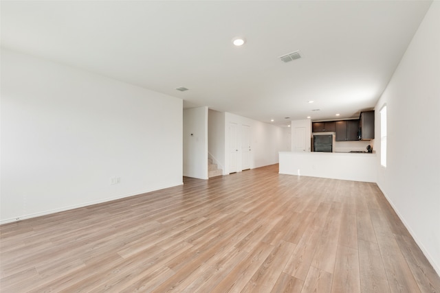 unfurnished living room with light hardwood / wood-style floors