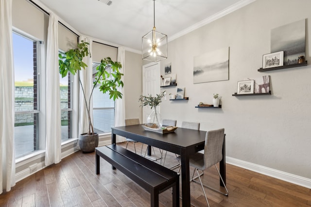 dining area with hardwood / wood-style flooring, plenty of natural light, and ornamental molding