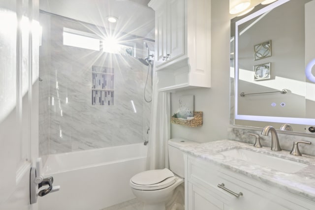 full bathroom featuring shower / tub combo with curtain, vanity, and toilet