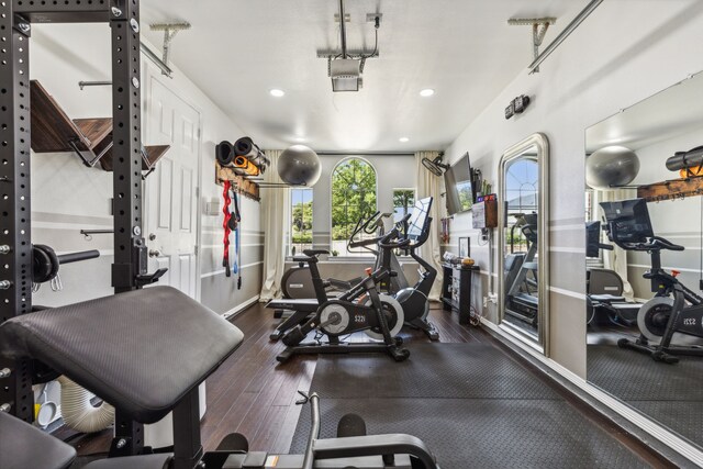 gym featuring dark hardwood / wood-style flooring