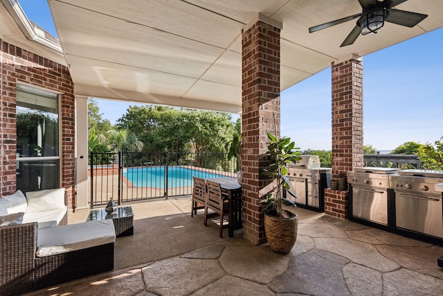 view of patio / terrace with a fenced in pool, area for grilling, and ceiling fan