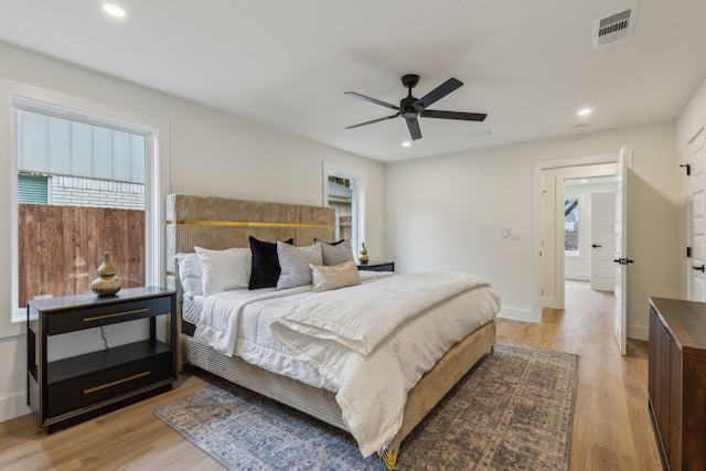 bedroom featuring light hardwood / wood-style floors and ceiling fan