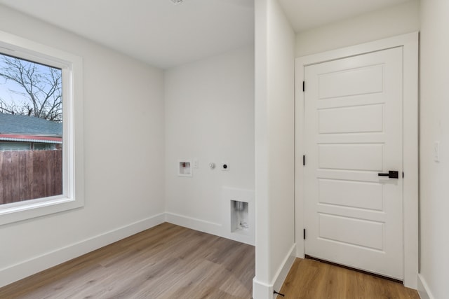 washroom featuring washer hookup, light wood-type flooring, and hookup for an electric dryer