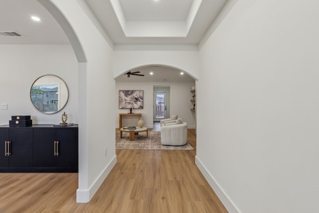 hallway with light hardwood / wood-style flooring