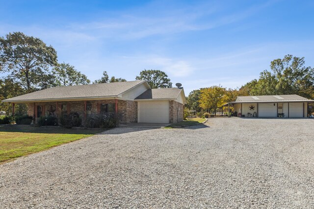 ranch-style house with a front yard and a garage