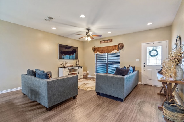 living room with ceiling fan and wood-type flooring