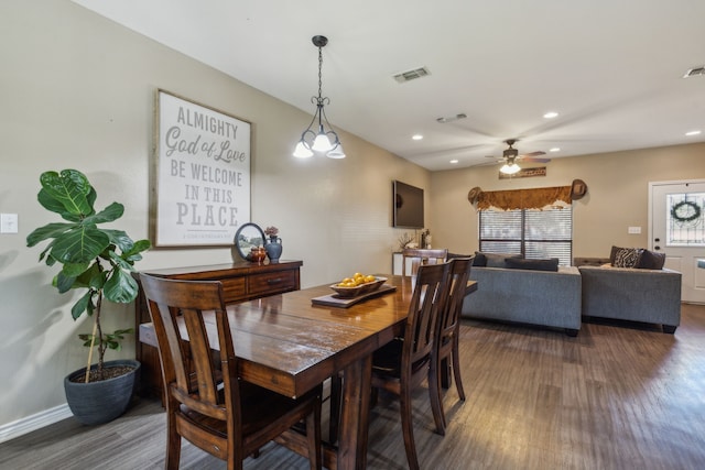 dining space featuring ceiling fan and dark hardwood / wood-style flooring