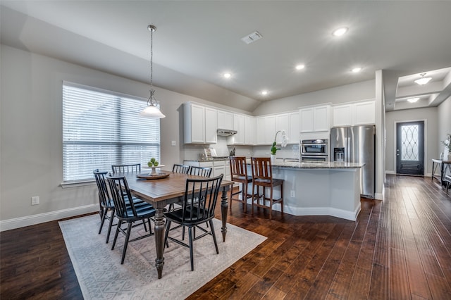 dining area with dark hardwood / wood-style floors