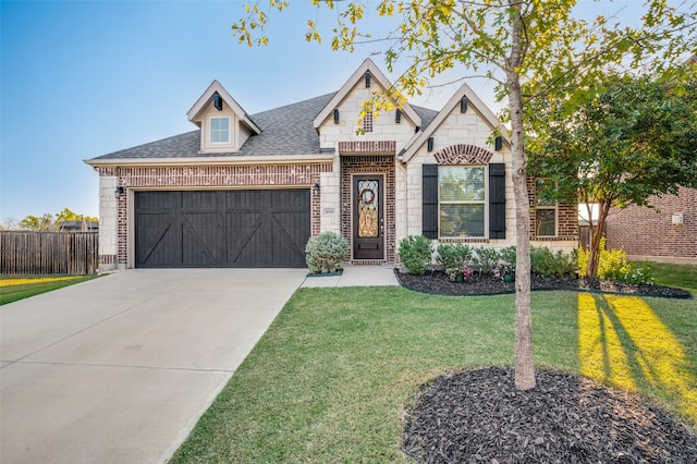 view of front facade featuring a front yard and a garage