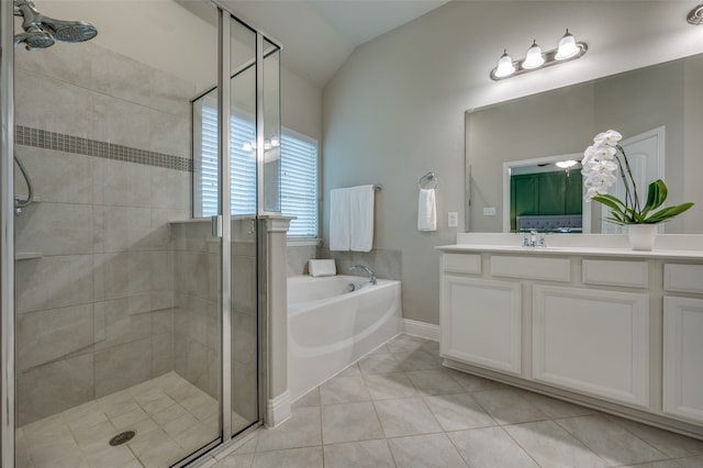 bathroom featuring vanity, tile patterned flooring, plus walk in shower, and lofted ceiling