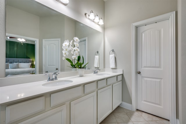 bathroom with tile patterned flooring and vanity