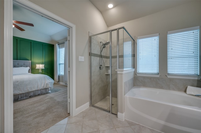 bathroom featuring separate shower and tub, ceiling fan, tile patterned flooring, and lofted ceiling