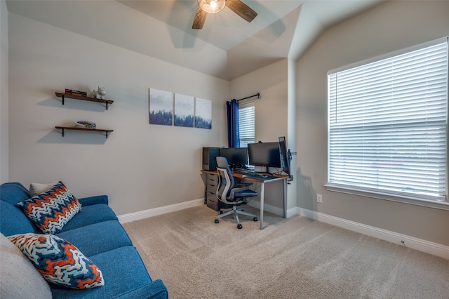 carpeted office with ceiling fan and vaulted ceiling