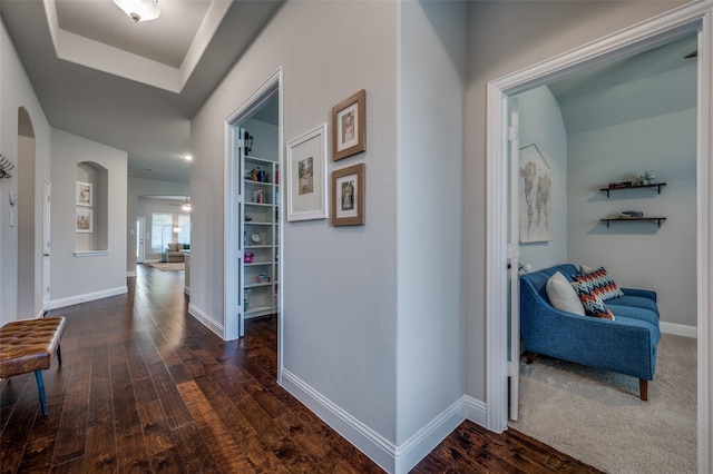 hall with dark hardwood / wood-style floors