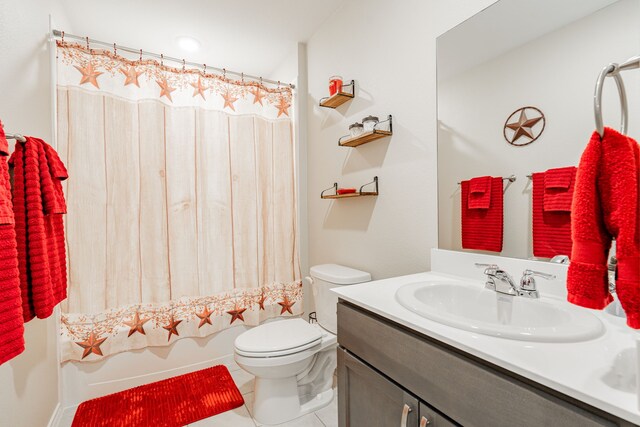 full bathroom featuring tile patterned floors, vanity, toilet, and shower / tub combo