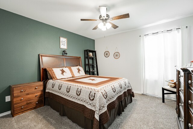 bedroom featuring ceiling fan and light colored carpet