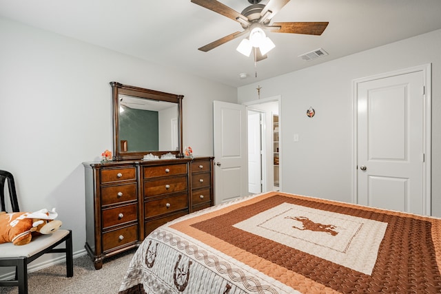 bedroom featuring ceiling fan and light carpet