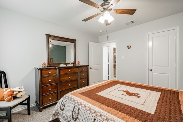 bedroom featuring ceiling fan and light carpet