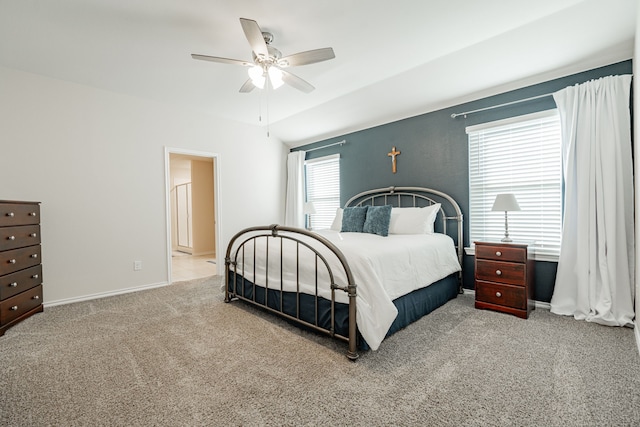 carpeted bedroom with multiple windows and ceiling fan