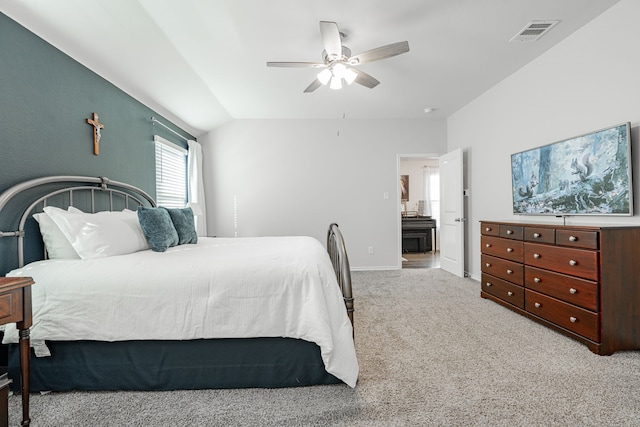 bedroom featuring light carpet, vaulted ceiling, and ceiling fan