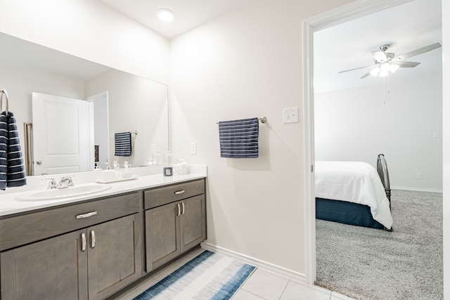 bathroom featuring tile patterned flooring, ceiling fan, and vanity