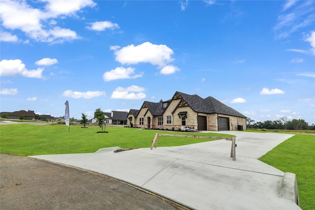 french country inspired facade featuring a garage and a front yard