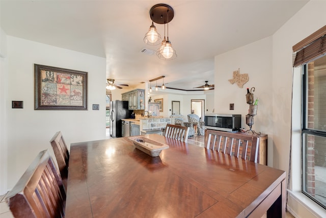 dining room featuring ceiling fan