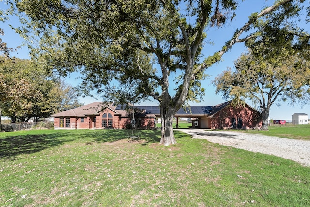 ranch-style home featuring a front yard