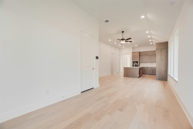 unfurnished living room with ceiling fan, light wood-style flooring, recessed lighting, baseboards, and visible vents