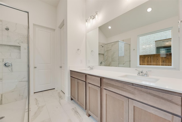 full bathroom with a sink, a marble finish shower, recessed lighting, and marble finish floor