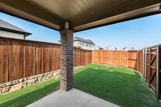 view of yard featuring a patio and a fenced backyard