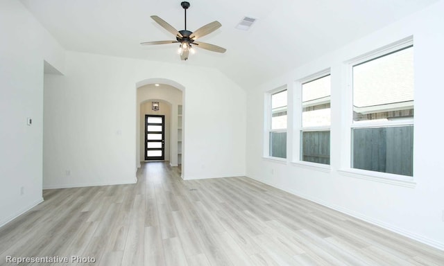 unfurnished room featuring light hardwood / wood-style flooring, ceiling fan, and lofted ceiling