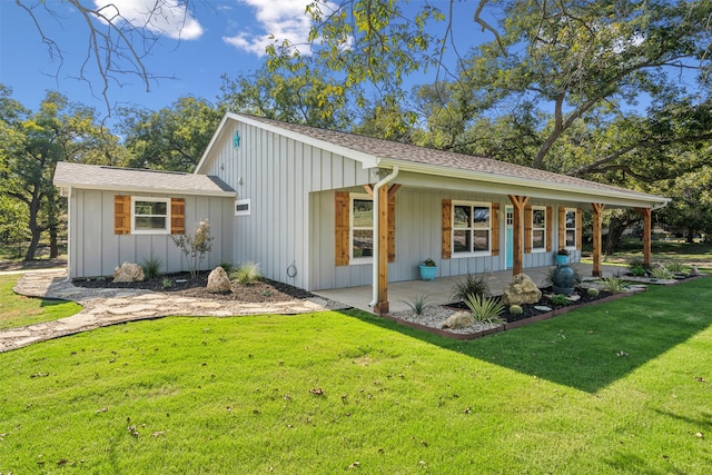 view of home's exterior with a porch and a lawn