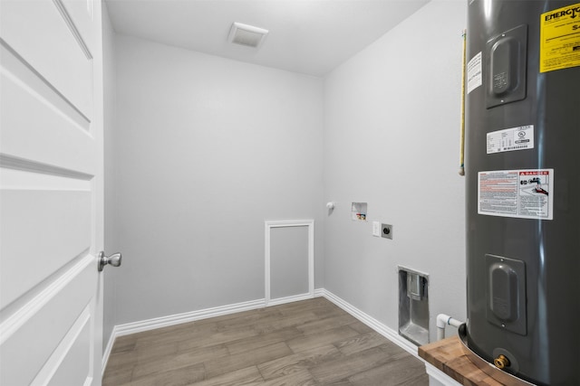 laundry area with hardwood / wood-style floors, washer hookup, hookup for an electric dryer, and water heater