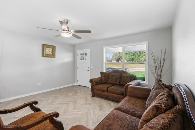 living room with light parquet flooring and ceiling fan