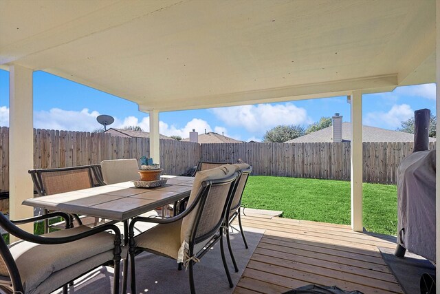 wooden deck with a yard