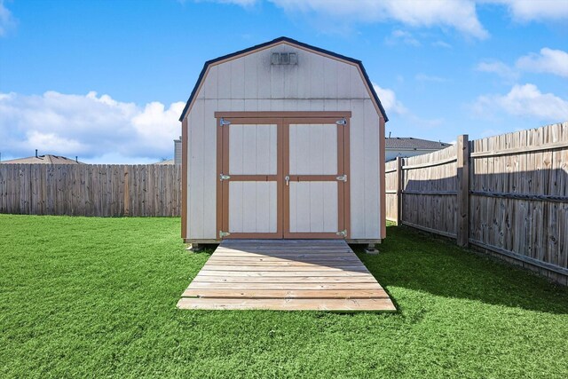 view of outdoor structure featuring a lawn