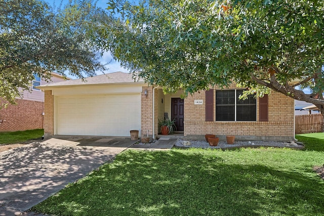 view of front of house with a garage and a front lawn