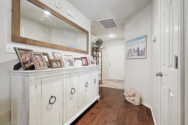 hallway with dark hardwood / wood-style flooring